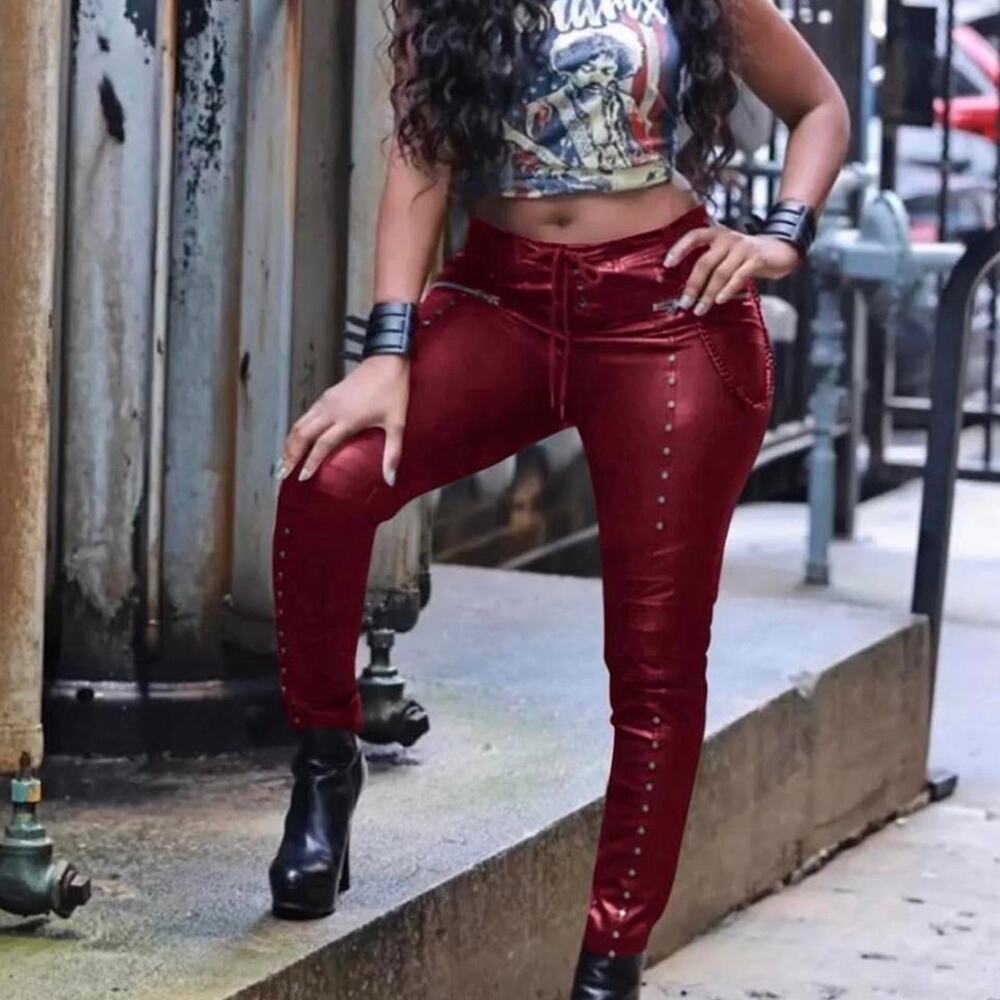 Red Faux Leather Pants with Zipper Details and Stud Accents.